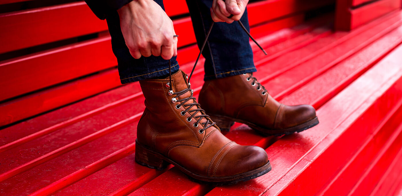 Man tying up boot laces